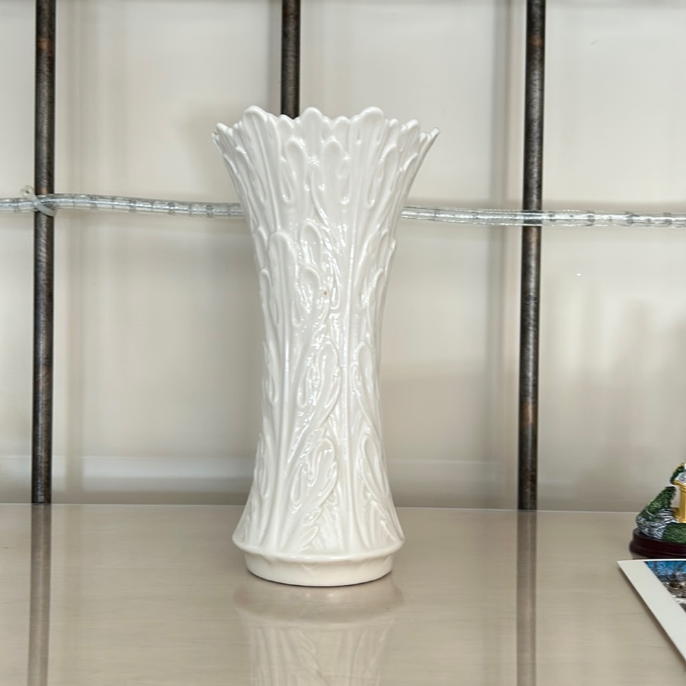 Lenox cream color 8-1/2 vase . Very pretty details lovely for display all year .